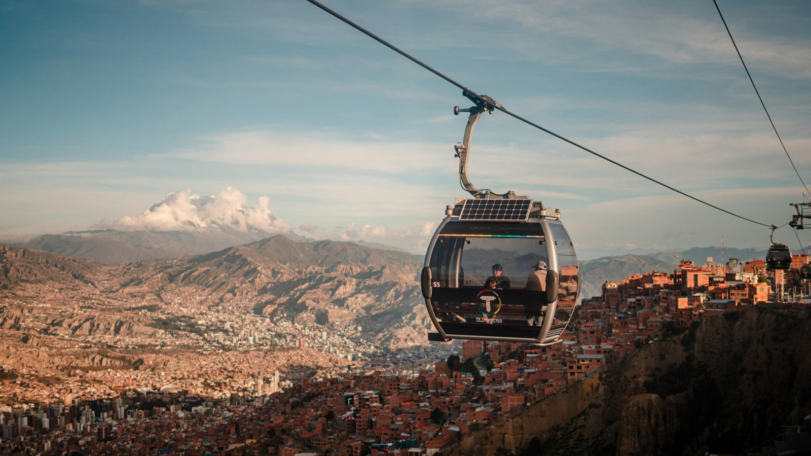 Stunning aerial view of La Paz with cable car transport at sunset.